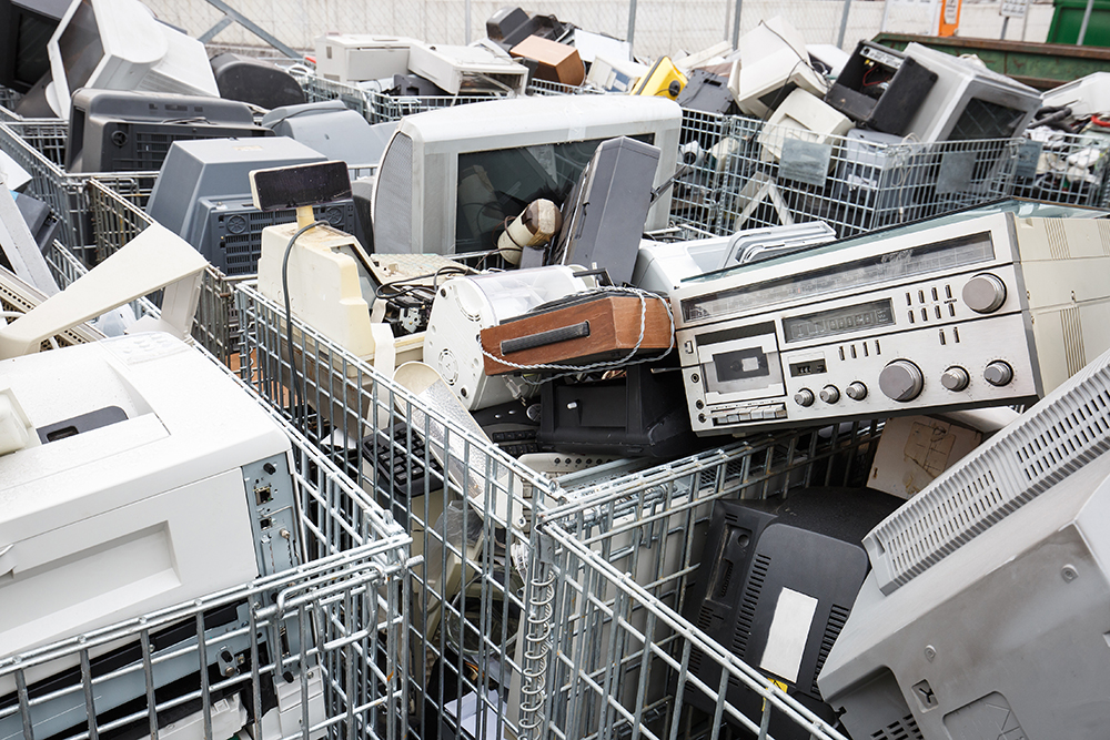 pile of discarded electronics - E-Waste Crisis